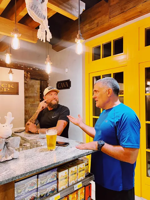Chef Tayo and Chef Jose Lopez talking in the kitchen