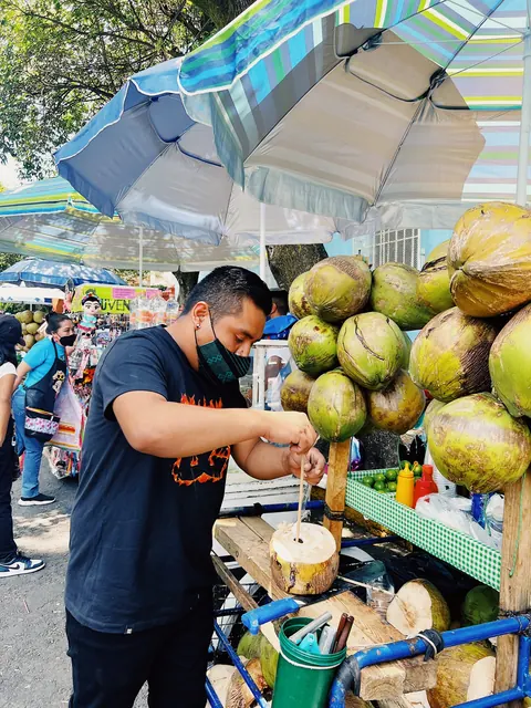 A fresh coconut street vendor