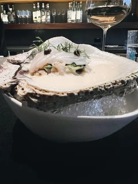 A seafood course served in a shell at Pujol