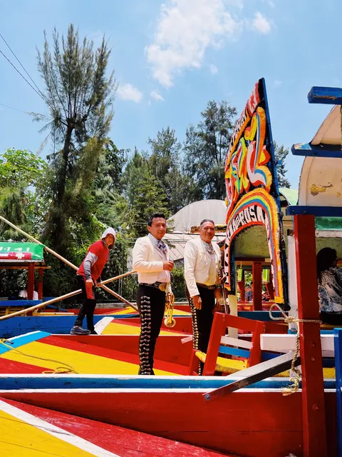 Mariachi musicians aboard a Xochimilco boat