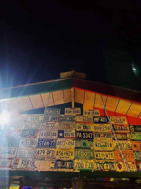 Nighttime bar with vintage license plates in St. Kitts and Nevis