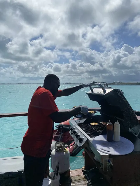Grilling over turquoise water