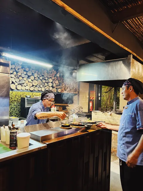 Chefs working in the open kitchen at Sentido Norte